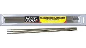 This image shows a person using a stick welder to repair a metal farm equipment part.