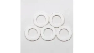 The image shows a collection of essential nozzle insulator rings for MIG welding, featured in a top 10 list.