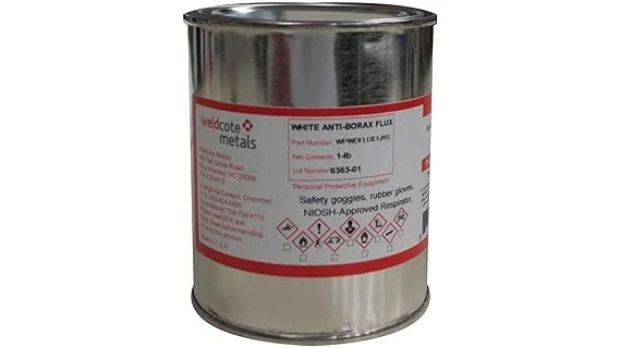 The image shows a collection of various welding and brazing flux powders in containers.