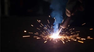 The image shows MIG welder settings on a dial, illustrating how to adjust them for better weld quality.