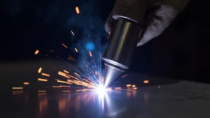 The image shows a close-up of a beautifully cleaned aluminum TIG weld, illustrating improved appearance.