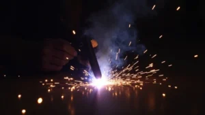 The image shows a welding arc experiencing arc blow, illustrating Mig Welder Arc Blowing Out? Quick Solutions.