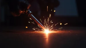 The image shows a stick welder producing a short circuit, illustrating troubleshooting tips for this welding issue.