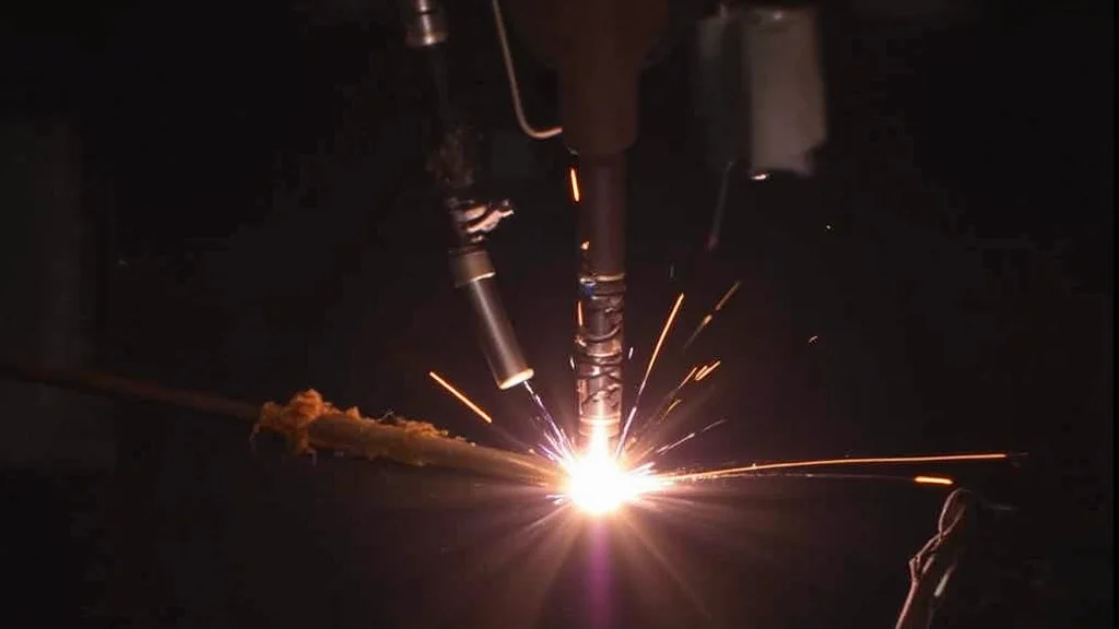 The image shows a Tig welder setup, illustrating a low gas flow issue discussed in the troubleshooting guide.