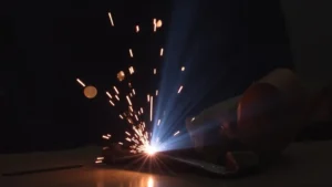 The image shows a Tig welder setup with a connection point that might be the source of a gas leak issue.